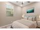 Bright bedroom featuring a soothing color scheme, neutral walls, and a window letting in natural light at 3637 E Ebano St, Gilbert, AZ 85295