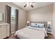 Inviting bedroom features a soft color palette, plush carpeting, and large window for natural light at 3637 E Ebano St, Gilbert, AZ 85295