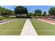 Outdoor bocce ball court with lush landscaping and well-maintained lawn at 3637 E Ebano St, Gilbert, AZ 85295