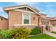 Charming home features a stone facade and landscaped yard with brick pathway for added curb appeal at 3637 E Ebano St, Gilbert, AZ 85295