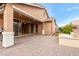 Inviting covered patio featuring ample space, access to water feature, and smooth transition to the interior at 3637 E Ebano St, Gilbert, AZ 85295