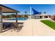 Community pool area with lounge chairs, shade and blue awning at 3637 E Ebano St, Gilbert, AZ 85295