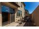 A cozy backyard patio with brick pavers, a table and chairs for outdoor dining and entertaining at 3914 S 58Th Ln, Phoenix, AZ 85043