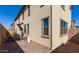 Backyard brick paver patio with small table and chairs, on the side of the home at 3914 S 58Th Ln, Phoenix, AZ 85043