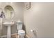 Half bath with pedestal sink and commode at 3914 S 58Th Ln, Phoenix, AZ 85043
