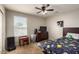 Bedroom with themed decor, a ceiling fan, and a bright window at 3914 S 58Th Ln, Phoenix, AZ 85043