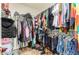 Walk-in closet well organized with plentiful hanging clothes, shoes, and storage options at 3914 S 58Th Ln, Phoenix, AZ 85043