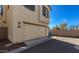 Attached two-car garage with beige door and exterior lights at 3914 S 58Th Ln, Phoenix, AZ 85043