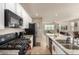 Modern kitchen with granite countertops and stainless steel appliances and view into living room at 3914 S 58Th Ln, Phoenix, AZ 85043