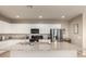 Bright kitchen with large island, granite countertops, and white cabinetry at 3914 S 58Th Ln, Phoenix, AZ 85043