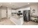 Bright kitchen features granite counters, stainless appliances and white cabinets at 3914 S 58Th Ln, Phoenix, AZ 85043