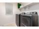 Functional laundry room featuring modern washer and dryer with lots of storage at 3914 S 58Th Ln, Phoenix, AZ 85043