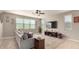 Bright living room with a large window, plush sofa, and stylish decor at 3914 S 58Th Ln, Phoenix, AZ 85043