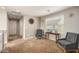 Comfortable living room featuring neutral walls and carpet, with two cozy chairs near bright window at 3914 S 58Th Ln, Phoenix, AZ 85043
