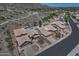 Aerial view of desert home with a private pool and a picturesque mountain backdrop at 4016 E Western Star Blvd, Phoenix, AZ 85044