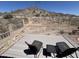 The backyard deck has two outdoor chairs and a spectacular mountain view at 4016 E Western Star Blvd, Phoenix, AZ 85044