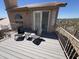 Image shows a second story balcony overlooking a view with a seating area including chairs and small table at 4016 E Western Star Blvd, Phoenix, AZ 85044
