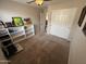 Bedroom with carpet flooring, closet space, and a ceiling fan at 4016 E Western Star Blvd, Phoenix, AZ 85044