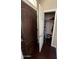 A foyer with an open closet area and rich dark wood door at 4016 E Western Star Blvd, Phoenix, AZ 85044