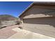 Attached two-car garage with neutral door, concrete driveway, and desert landscaping at 4016 E Western Star Blvd, Phoenix, AZ 85044