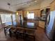 Bright kitchen with stainless appliances, spacious island, and abundant cabinet space, with green pendant lights at 4016 E Western Star Blvd, Phoenix, AZ 85044