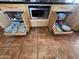 Convenient lower cabinet storage solution with microwave and various dishes at 4016 E Western Star Blvd, Phoenix, AZ 85044