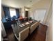 Stylish living room with dining table, blue couches, orange chairs, and ample seating for entertaining at 4016 E Western Star Blvd, Phoenix, AZ 85044