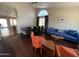 Open-concept living and dining area with hardwood floors, archways, and modern furnishings at 4016 E Western Star Blvd, Phoenix, AZ 85044