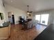 Inviting living room with tile floors, ceiling fan, sliding glass doors, and a fireplace at 4016 E Western Star Blvd, Phoenix, AZ 85044