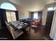 Open-concept living and dining area featuring hardwood floors, large windows and modern furnishings at 4016 E Western Star Blvd, Phoenix, AZ 85044