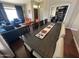 Spacious living room with dining table, bright natural light, cozy couches, and ample seating at 4016 E Western Star Blvd, Phoenix, AZ 85044