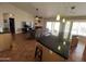 Open-concept living room and kitchen area with tile floors, fireplace, and sliding glass doors to the outdoors at 4016 E Western Star Blvd, Phoenix, AZ 85044