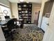 Comfortable home office featuring ample lighting and floor to ceiling bookshelves at 4016 E Western Star Blvd, Phoenix, AZ 85044