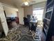 Functional office space with a bright window and comfortable work area, flowing from the dining room at 4016 E Western Star Blvd, Phoenix, AZ 85044