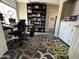Home office with desk, chair, and bookshelf at 4016 E Western Star Blvd, Phoenix, AZ 85044