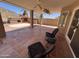 Covered patio with outdoor kitchen, ceiling fans, and comfortable seating, perfect for enjoying outdoor living at 4016 E Western Star Blvd, Phoenix, AZ 85044