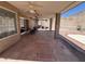 Covered patio with desert landscaping and relaxing seating area, with steps up to the rest of the yard at 4016 E Western Star Blvd, Phoenix, AZ 85044