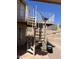 Image shows a white metal spiral staircase leading to a second story balcony with rod iron railing at 4016 E Western Star Blvd, Phoenix, AZ 85044