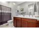 Bathroom features a double sink vanity, toilet, shower with tiled floors at 4044 E Dawson E Dr, Chandler, AZ 85249