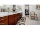 Bathroom features a double sink vanity, tile floors, and a walk-in closet at 4044 E Dawson E Dr, Chandler, AZ 85249