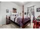 Bright bedroom features a four-poster bed, bedside table, and carpeted flooring at 4044 E Dawson E Dr, Chandler, AZ 85249