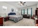 Bright bedroom features a ceiling fan, sitting area with sofa, and carpeted floor at 4044 E Dawson E Dr, Chandler, AZ 85249