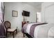 Bright bedroom features a four-poster bed, wall-mounted tv and carpeted flooring at 4044 E Dawson E Dr, Chandler, AZ 85249