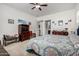 Bright bedroom features a bed with colorful patterned bedding and carpeted flooring at 4044 E Dawson E Dr, Chandler, AZ 85249