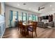 Elegant dining area with a wooden table, comfortable seating, and seamless access to the open-concept living room at 4044 E Dawson E Dr, Chandler, AZ 85249