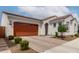 Inviting home featuring a well-maintained front yard, brick driveway, and an attached two-car garage at 4044 E Dawson E Dr, Chandler, AZ 85249