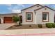 Charming single-story home featuring a well-manicured front yard with a two-car garage and appealing facade at 4044 E Dawson E Dr, Chandler, AZ 85249