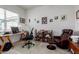 Home office with desk, rolling chair, bookshelf, leather armchair and an area rug at 4044 E Dawson E Dr, Chandler, AZ 85249
