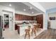 Spacious kitchen with granite countertops, stainless steel appliances, and a large center island with barstool seating at 4044 E Dawson E Dr, Chandler, AZ 85249
