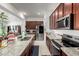 Modern kitchen featuring granite countertops, stainless steel appliances, and a convenient layout with ample counter space at 4044 E Dawson E Dr, Chandler, AZ 85249